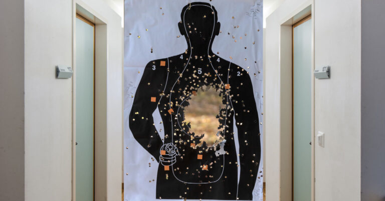 FBI target silhouette with lots of bullet holes, remember to take your keys