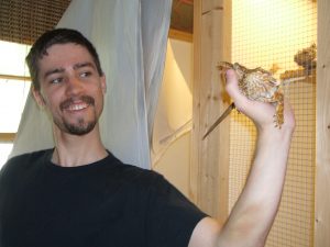 Dave, the volunteer, with a bearded dragon.